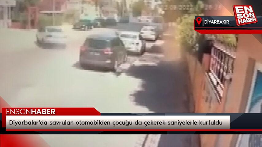 Diyarbakır’da savrulan arabadan çocuğu da çekerek saniyelerle kurtuldu
